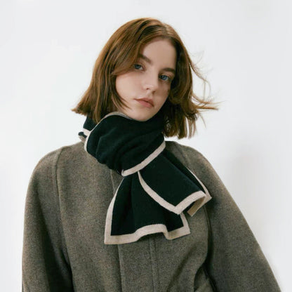 Model wearing a wool knit scarf in black, easy for weekend styling and gifting.