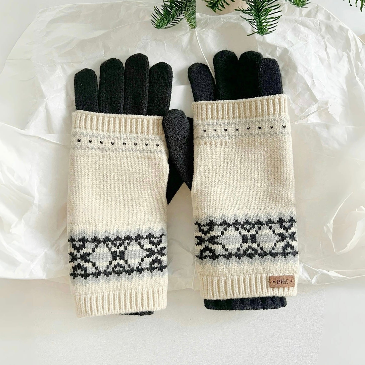 Convertible Fair Isle knit glove cuffs in navy with tan/cream pattern, paired with grey gloves; winter-ready.