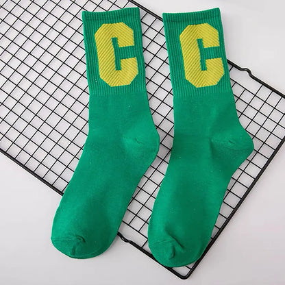 Flat lay of Cool C Socks in green, great for daily wear and lounging.