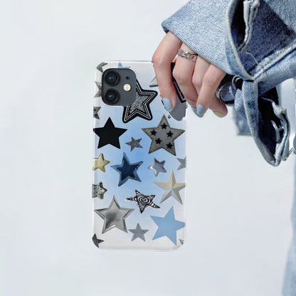 Clear silicone iPhone case with various black, silver, and blue stars. Transparent youthful design accessory.