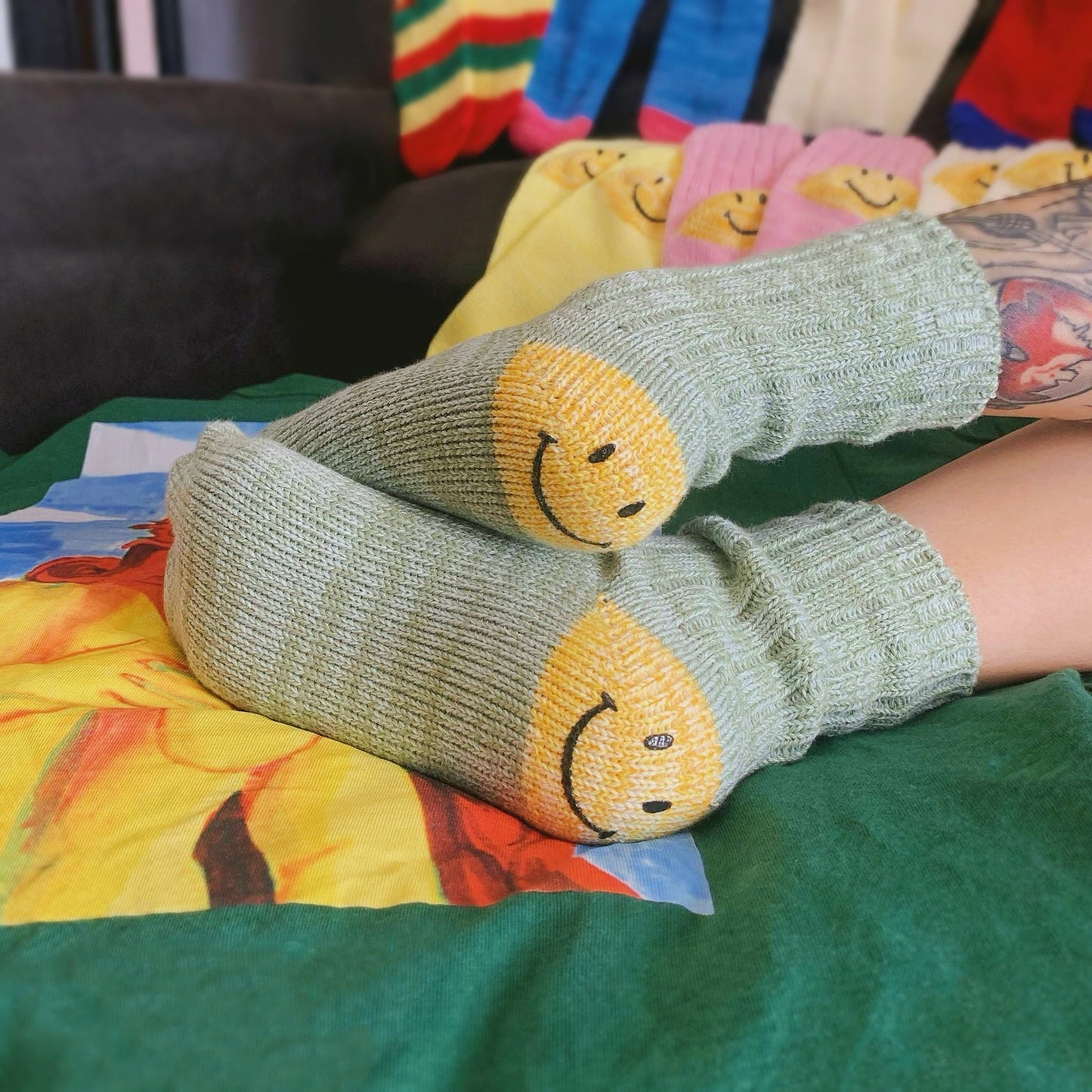Styling green smiley knitted socks for a cozy home aesthetic, featuring a trendy and happy street-style vibe.