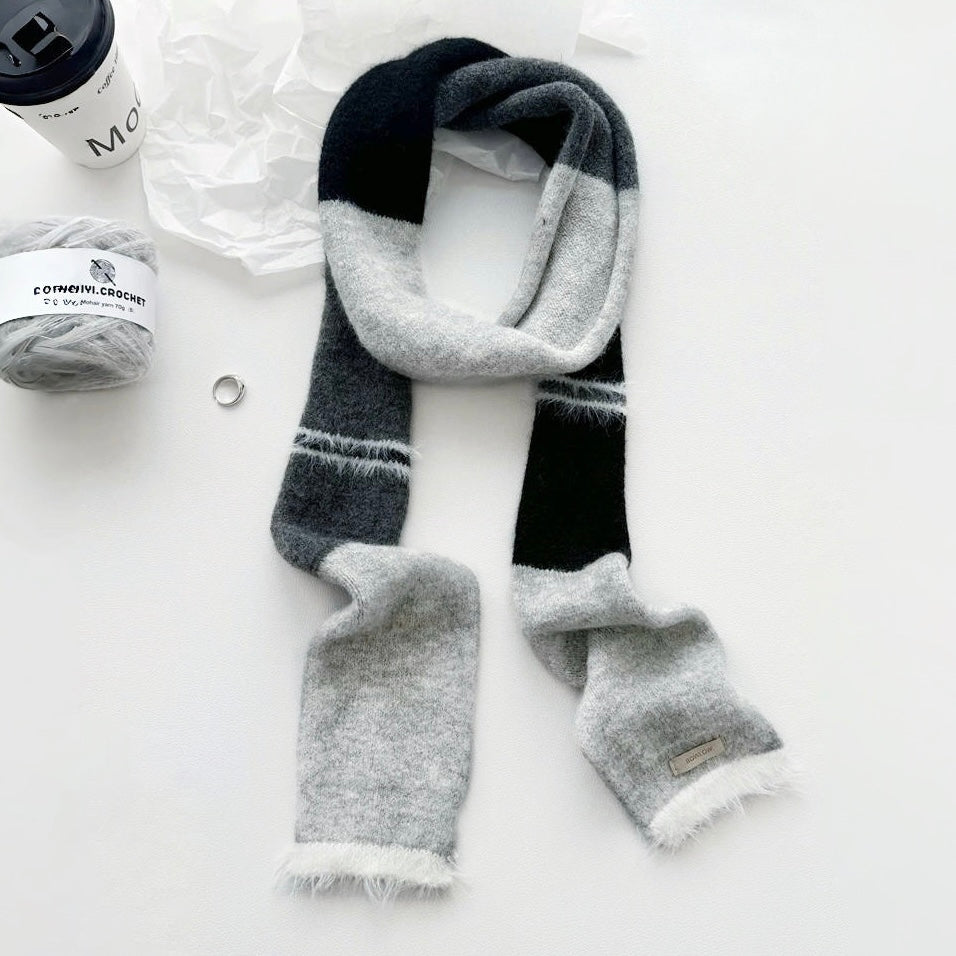 Flat lay of Cozy Patch Skinny Scarf in gray, great for office layering and commuting.