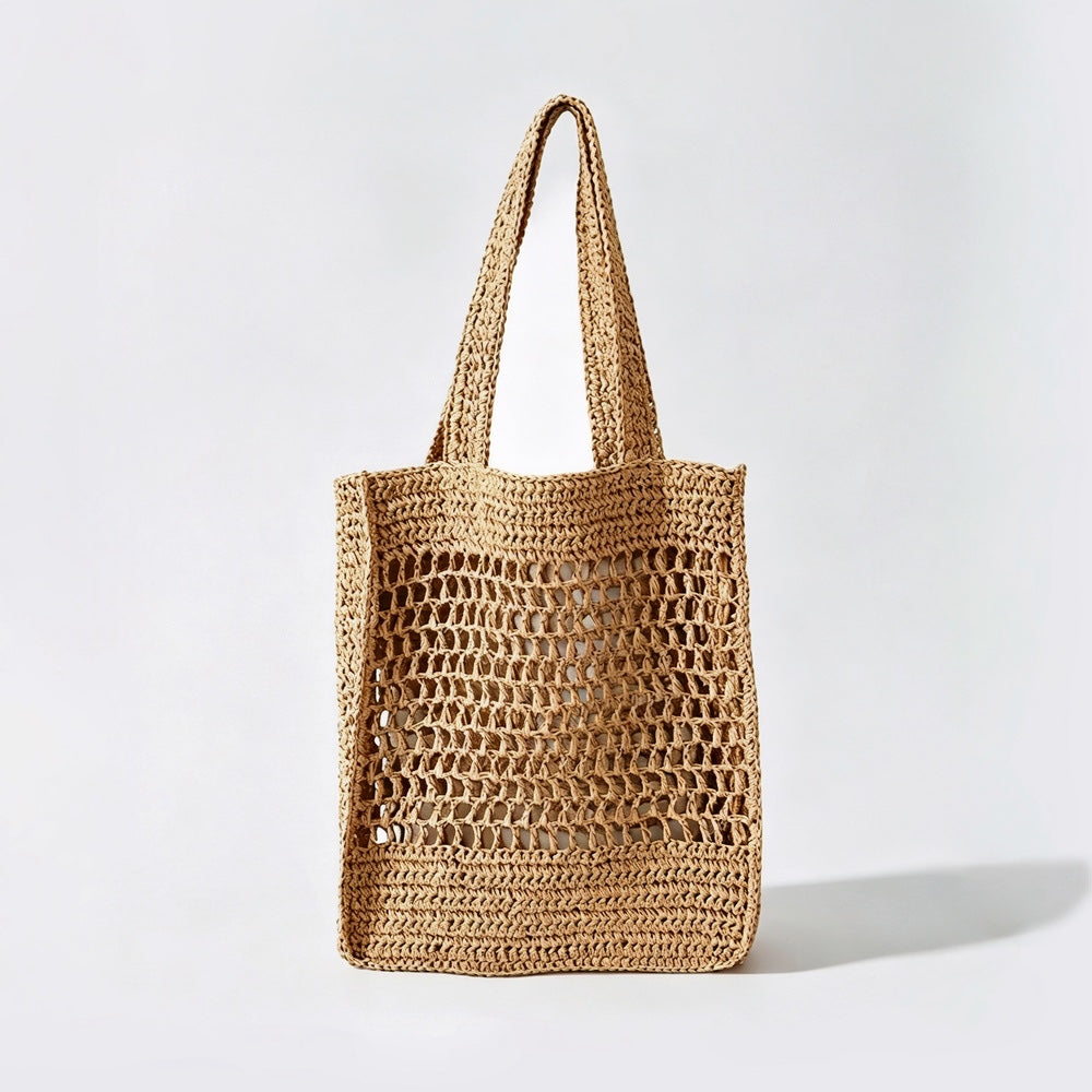 Front view of natural khaki crochet straw tote bag, boho vacation style.