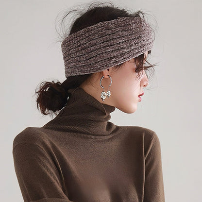 Model wearing a Crochet Velvet Twist Headband in rosy brown , ideal for quick updos and ponytails.