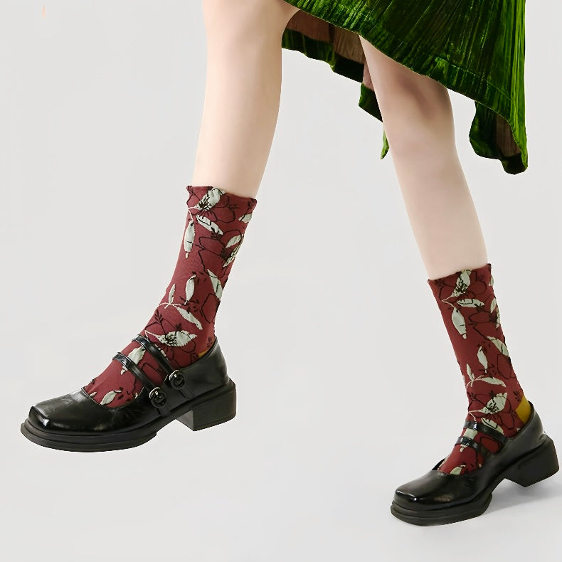 Model wearing a pair of Dancing Flower Socks, easy to pack for travel and errands.