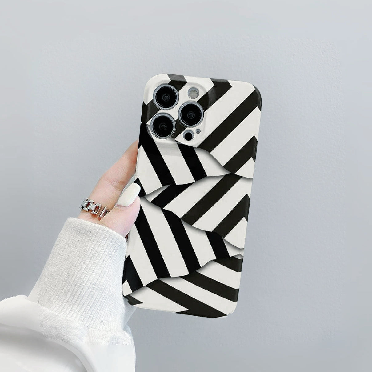 Black and white diagonal stripe pattern silicone case. Layered 3D texture for enhanced grip and style.