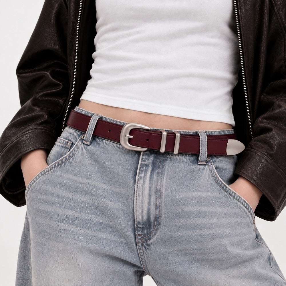 Model wearing the burgundy double keeper belt paired with blue jeans and a retro brown jacket.