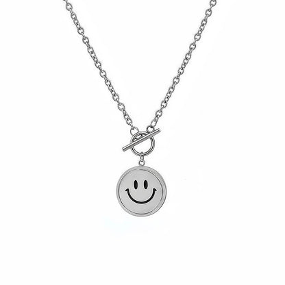 Front view of silver emoti spin necklace showing the toggle clasp and smiley pendant