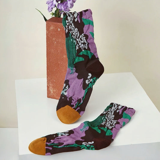 Front view of Fantasy Garden Socks: One pair of cotton-polyester socks with a dark brown base, purple floral.