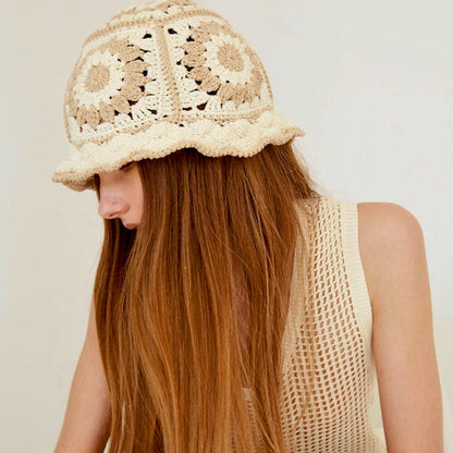 Model wearing beige Floral Crochet Hat. Subtle neutral palette with sophisticated handmade floral details.
