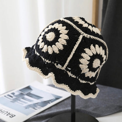 Front view of black Floral Crochet Hat. Versatile dark tone with detailed handcrafted crochet textures.
