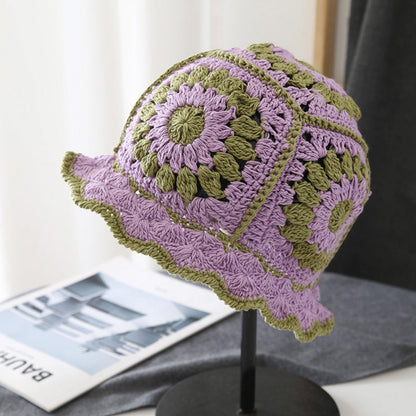 Front view of purple Floral Crochet Hat. Vibrant artistic patterns on a skin-friendly knitted frame.