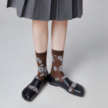 Model wearing a pair of  Floral Embroidered Socks in brown, ideal for workouts and commuting.