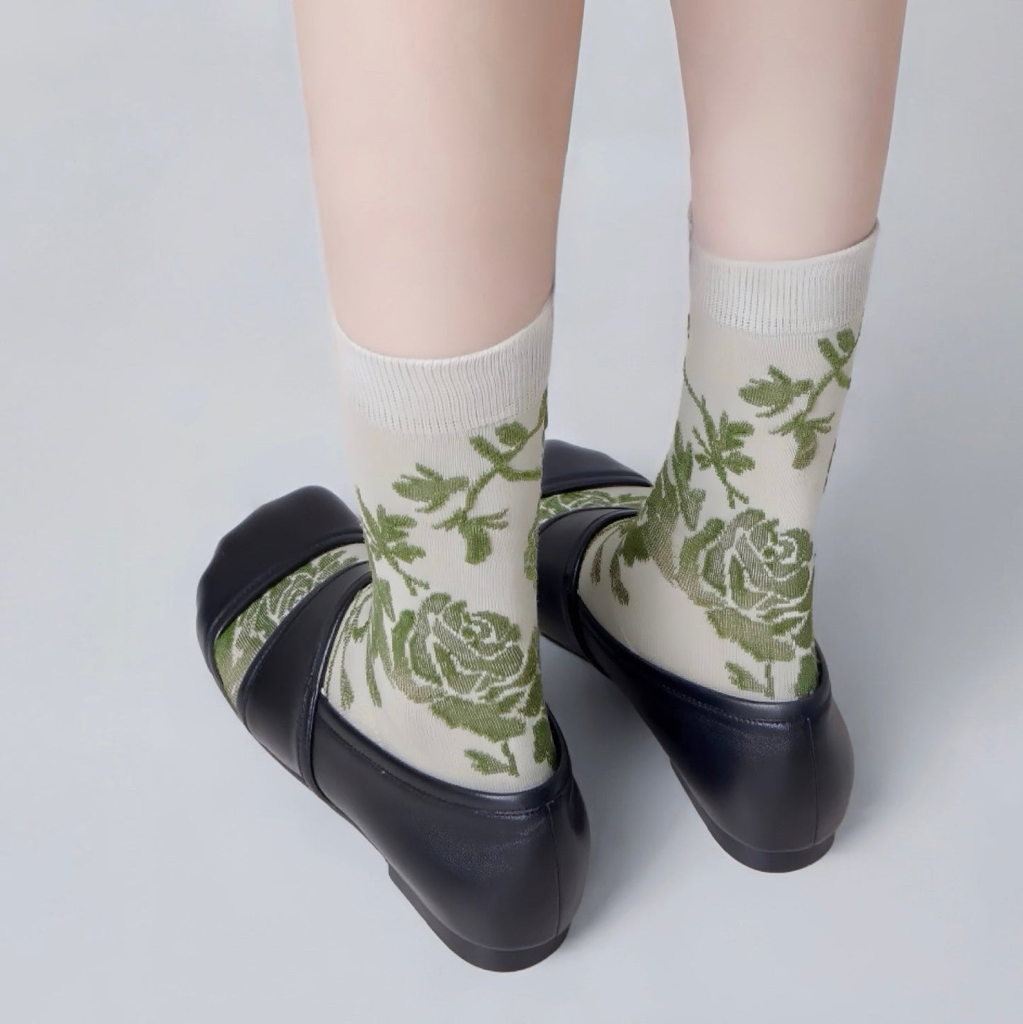 Angled view of Floral Embroidered Socksin celadon, great for daily wear and lounging.