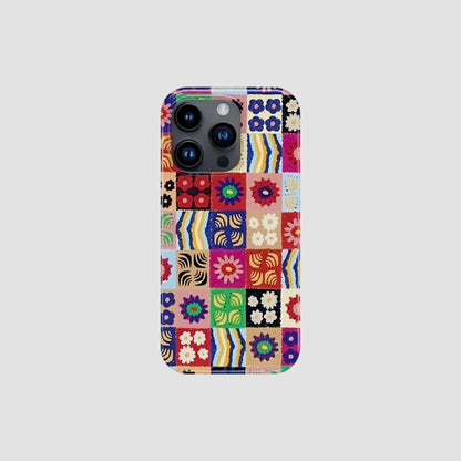 Silicone iPhone case with colorful floral patchwork design. Precise camera cutout for cottagecore fashion style.