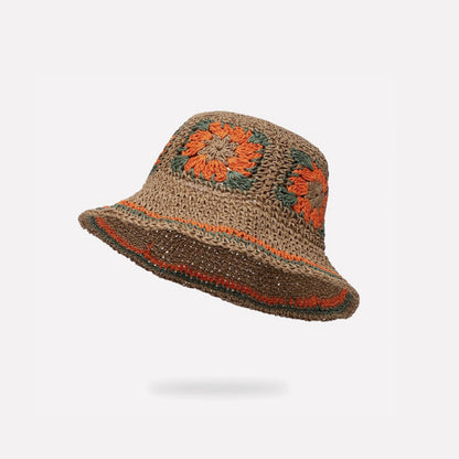 Front view of orange Floral Straw Hat. Bold sunset palette with contrasting floral accents for beach wear.