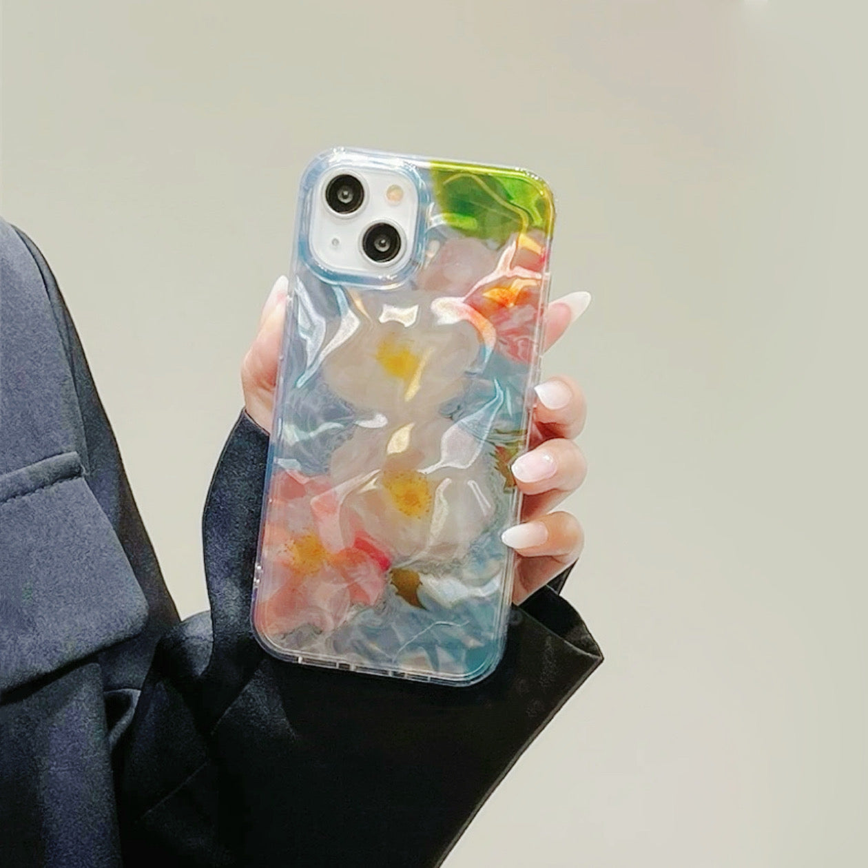 Model holding Flower In Water Case. Artistic watery floral design perfect for a soft feminine style.