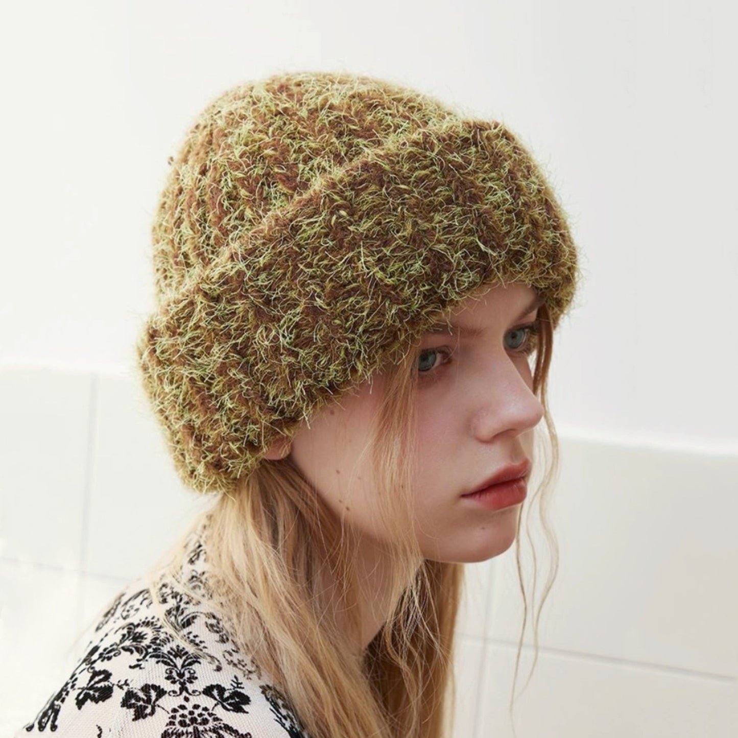 Fluffy knitted thick beanie in brown and lime green, showcasing high-density texture for extreme cold.