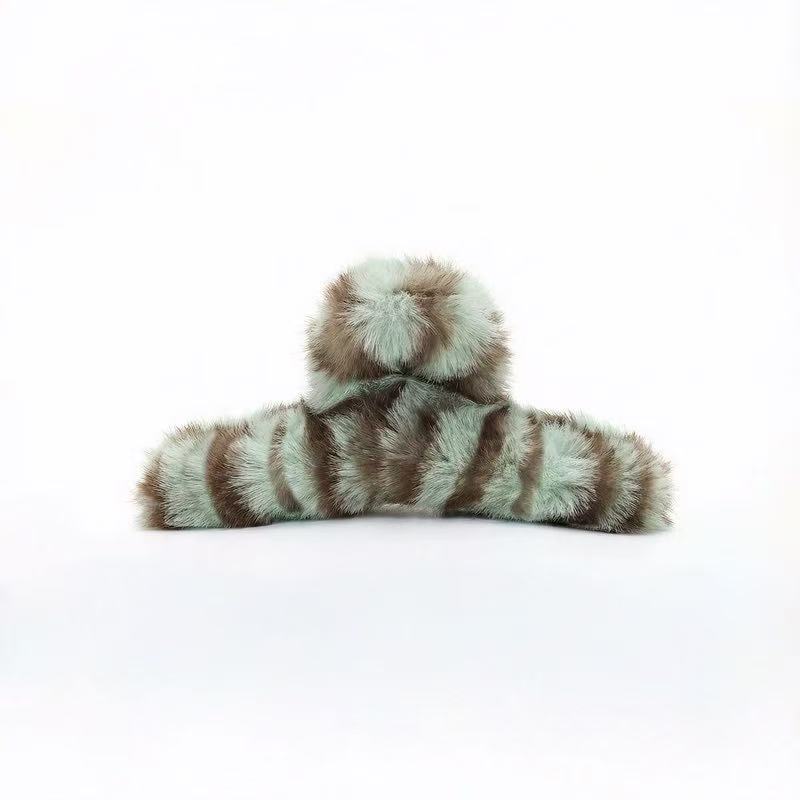 Folded view of Fluffy Striped Hair Claw in mint green , ideal for quick updos and ponytails.