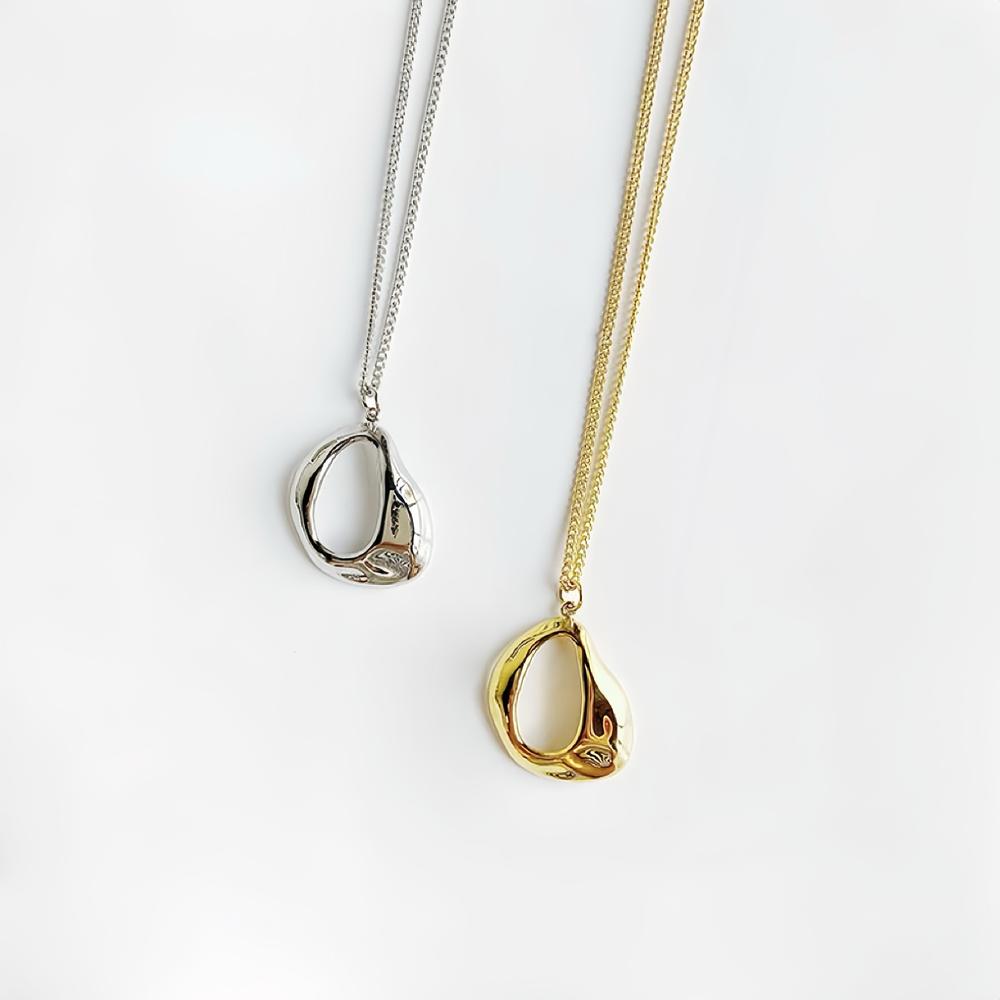 Front view of Fluid Shaped Pendant Necklaces in gold and silver , great for everyday outfits.