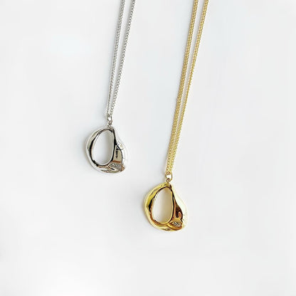 Front view of Fluid Shaped Pendant Necklaces in gold and silver , great for everyday outfits.