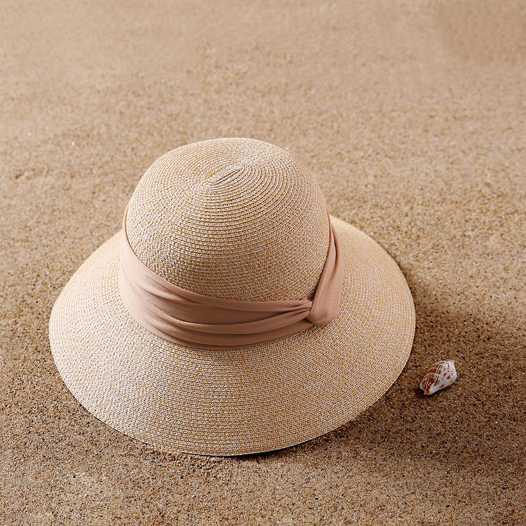Front view of beige Ribbon Straw Hat. Timeless neutral tone with a premium woven texture and elegant bow.
