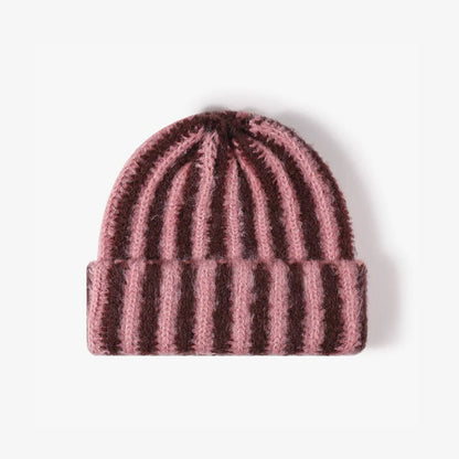 Brown and coral contrast striped fuzzy beanie with a soft knit texture.