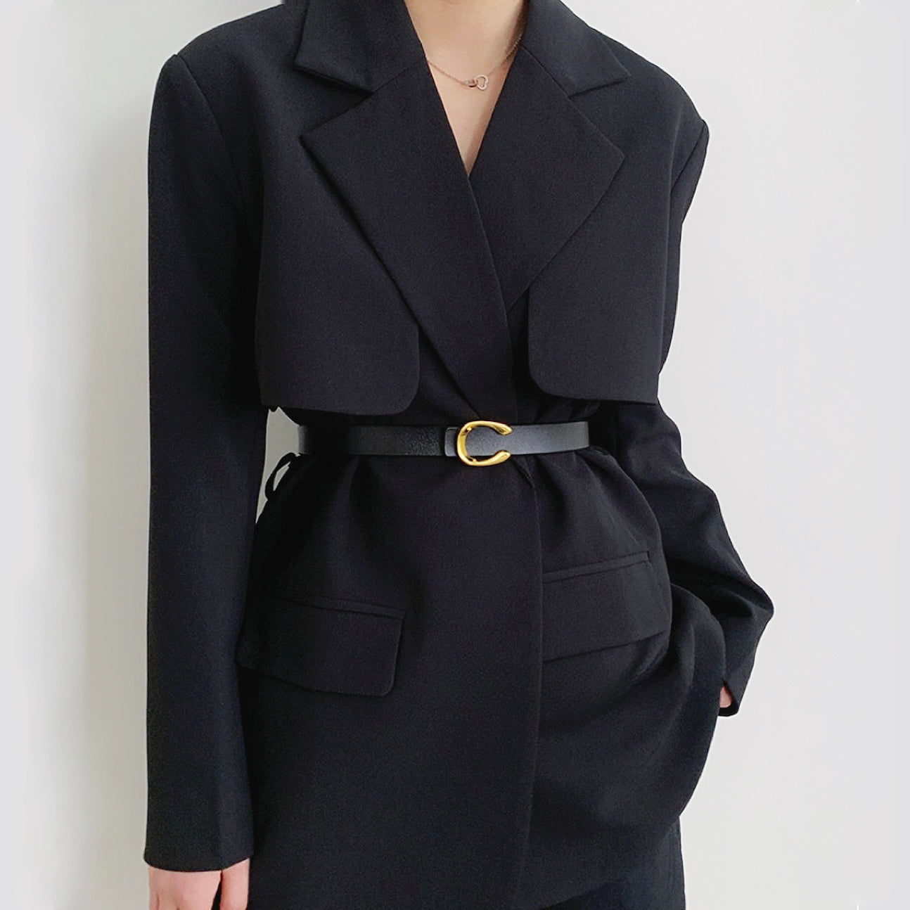 Side profile of model styling black Gold C Buckle Belt.