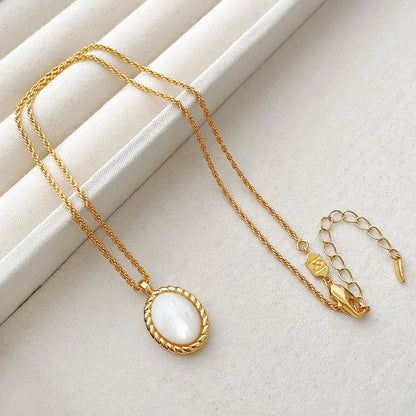Detailed view of the gold-tone jade necklace on a pure background, great for everyday outfits and gifting.