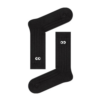 Folded view of Googly Eyes Socks in black, ideal for workouts and commuting.
