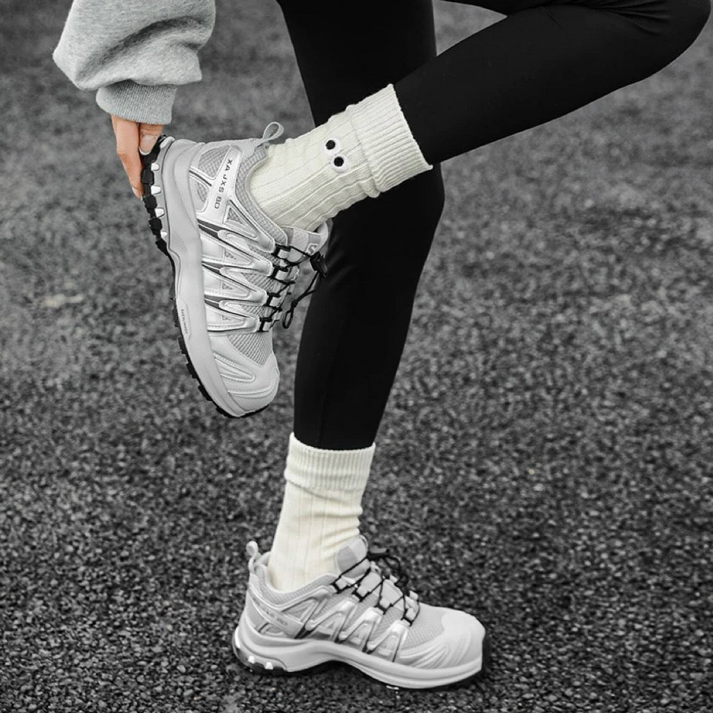 Model wearing Googly Eyes Socks in white, great for daily wear and lounging.