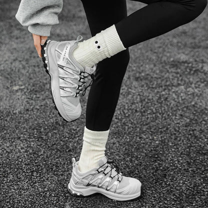 Model wearing Googly Eyes Socks in white, great for daily wear and lounging.