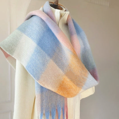 Model wearing the gradient plaid scarf as a full wrap-around shawl, easy for weekend.