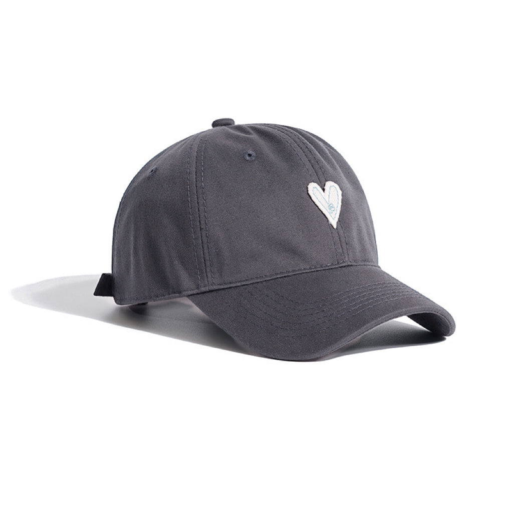 Grey cotton twill cap with white heart embroidery on a white background.