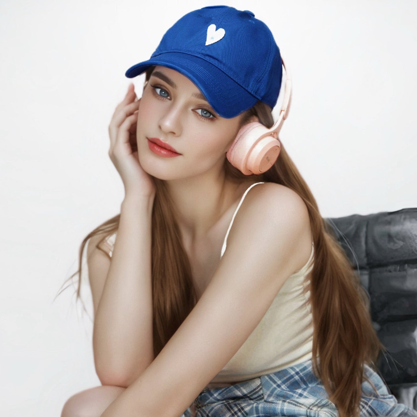 Klein blue cotton cap with white heart embroidery shown on a model.