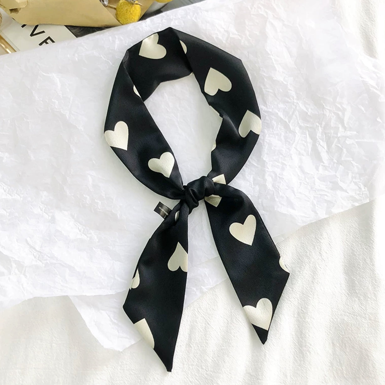 Close-up of Heart Pattern Skinny Scarf in navy and black, ideal for everyday styling and weekend outings.