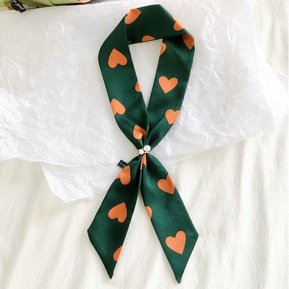 Model wearing a polyester scarf in green and orange, ideal for daily wear and travel.