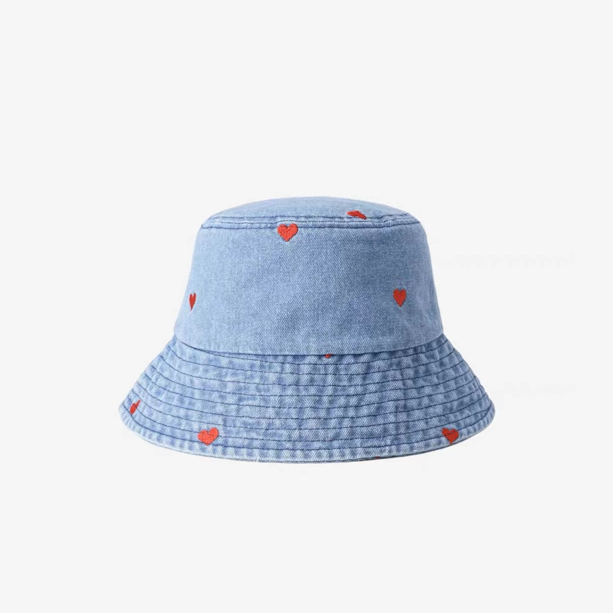 Front view of Heart Printed Bucket Hat in light blue, featuring durable denim and romantic heart prints for summer.