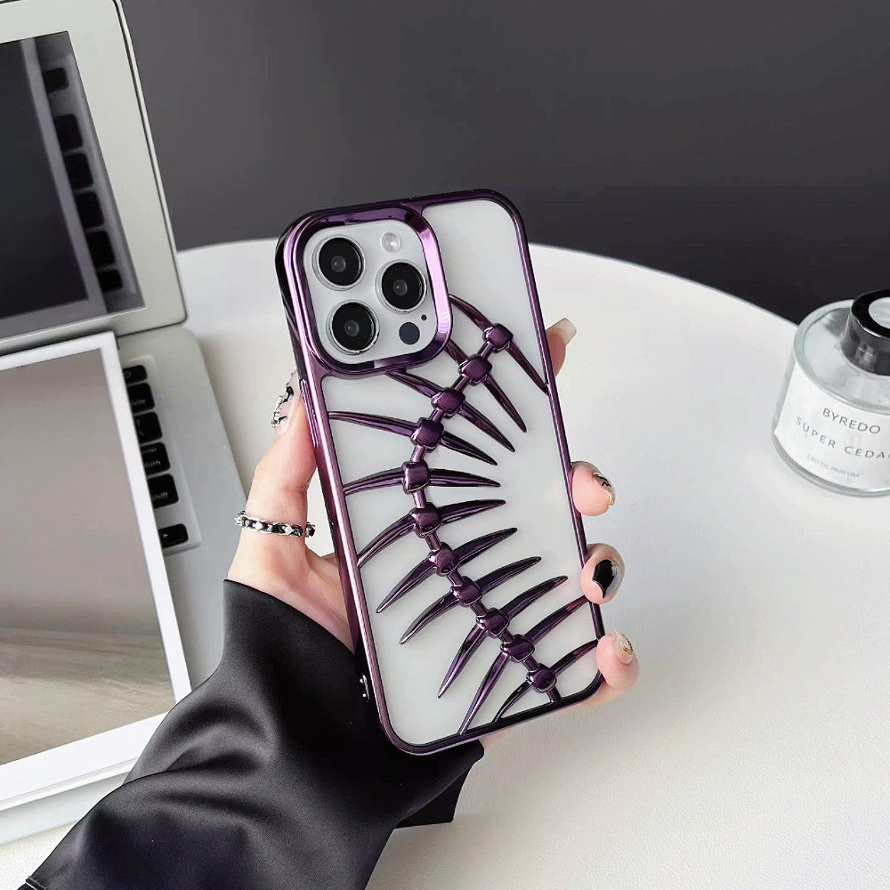 Model holding Hollow Fishbone Phone Case in polish purple. Unique trendy skeletal phone cover for Gen-Z.
