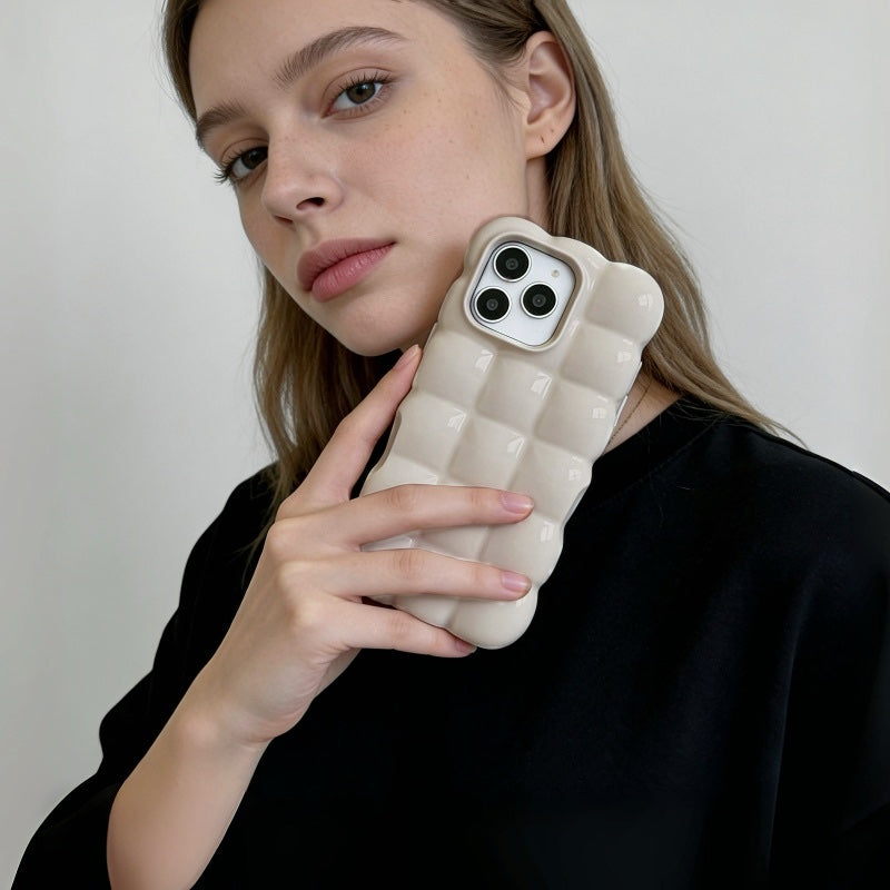 Model holding a milky beige jelly bubble phone case, highlighting the 3D Puffy silhouette.