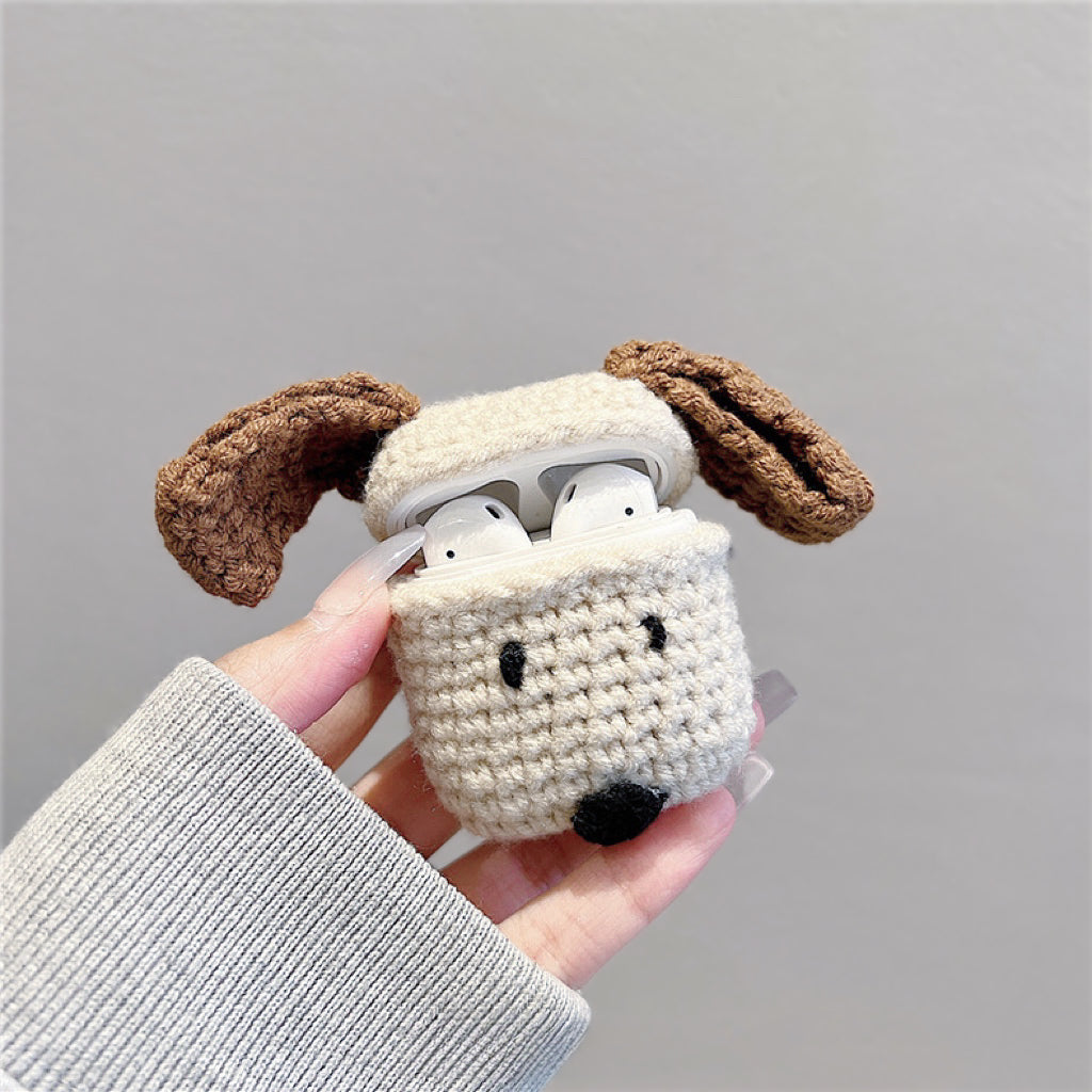 Model holding a Knitted Puppy Airpods Case Cover, ideal for gifting and everyday use.