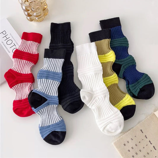 Front view of Six pairs of ribbed, cotton-blend Socks in red, dark green, light blue, white, black and yellow.