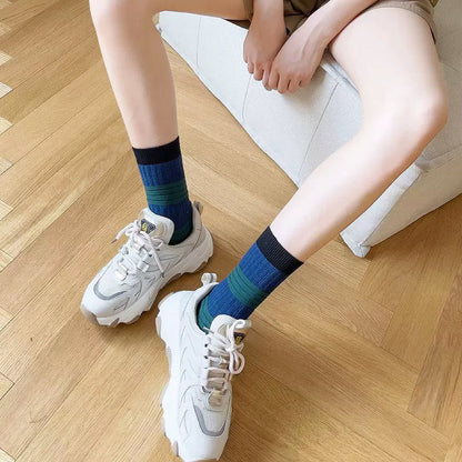 Model wearing a pair of dark green lantern socks, great for casual wear and light workouts.