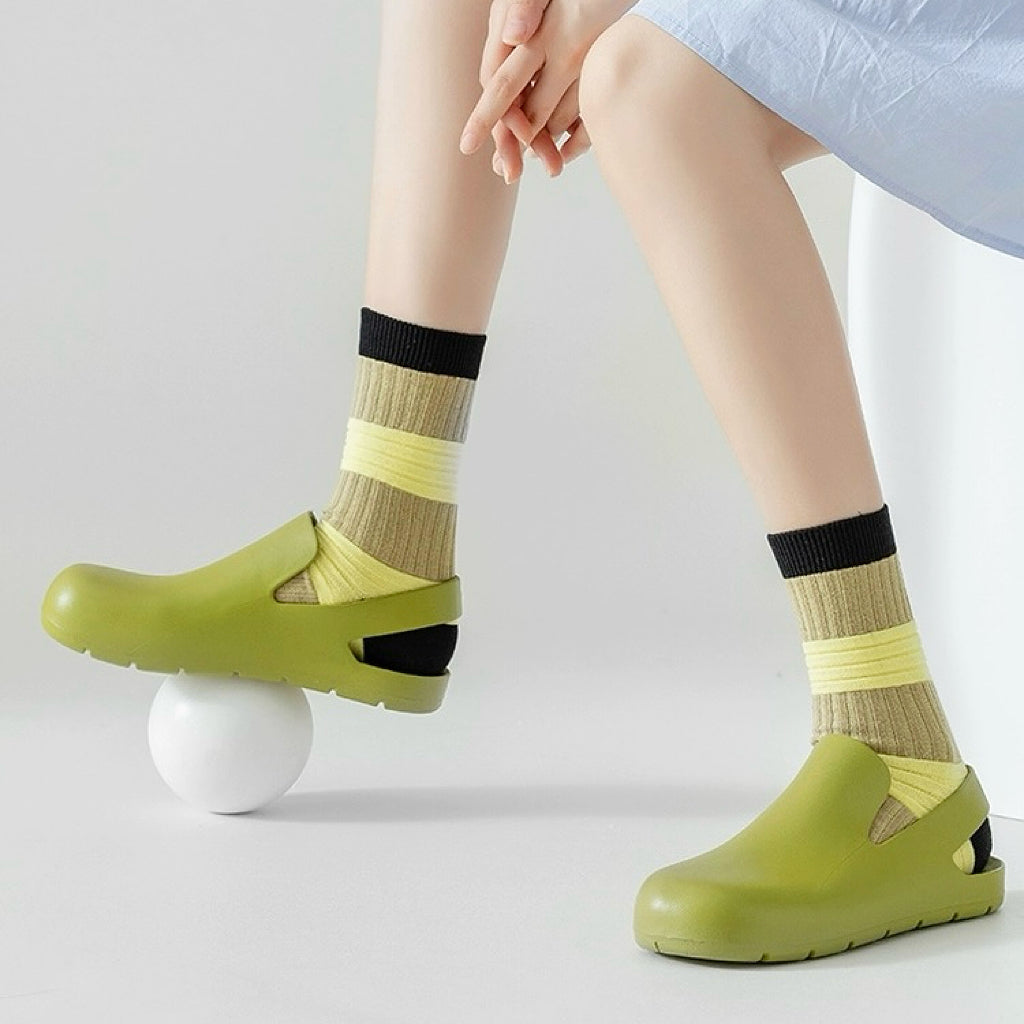 Model wearing a pair of yellow lantern socks, ideal for everyday outfits and sneakers.
