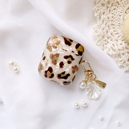 Angled view of Leopard Print AirPods Case Cover with shell charm, great for daily protection and travel.