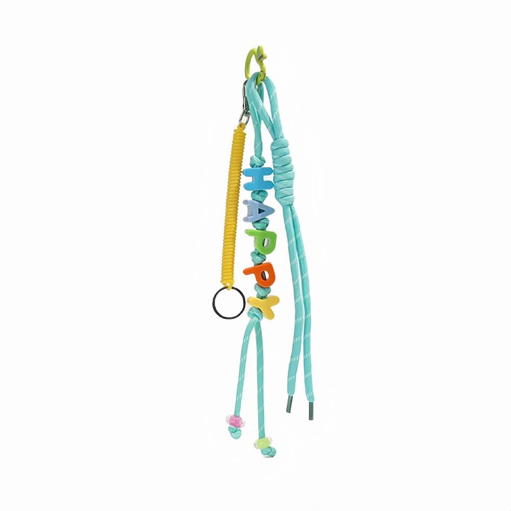 Flat lay of Letters Bag Charm  with LUCKY letters and blue ropes , great for everyday styling and gifting.