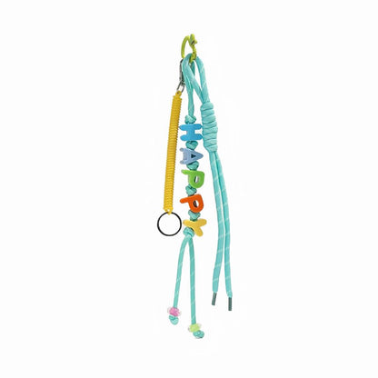 Flat lay of Letters Bag Charm  with LUCKY letters and blue ropes , great for everyday styling and gifting.