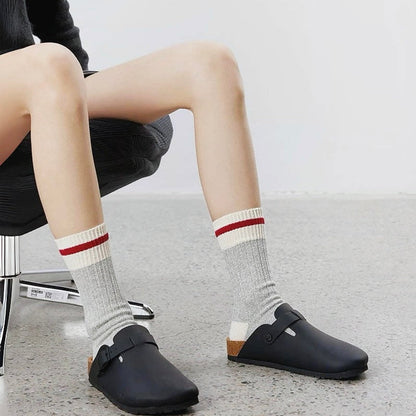 Model wearing a pair of London Time Knitted Socks in grey, great for casual wear and light workouts.