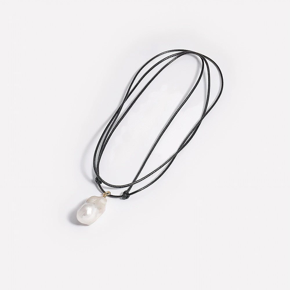 Close up of silver drop necklace showing adjustable extension chain and lobster clasp
