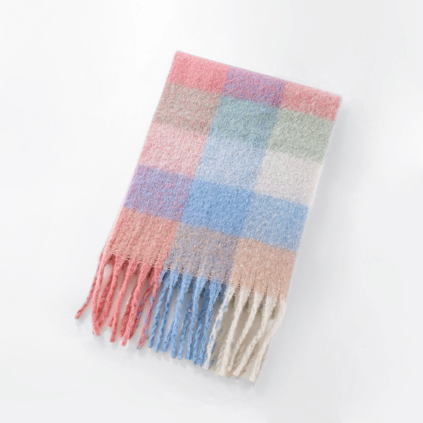 Flat lay of Soft pink and blue gradient plaid scarf with a fuzzy marshmallow texture, easy for travel packing.